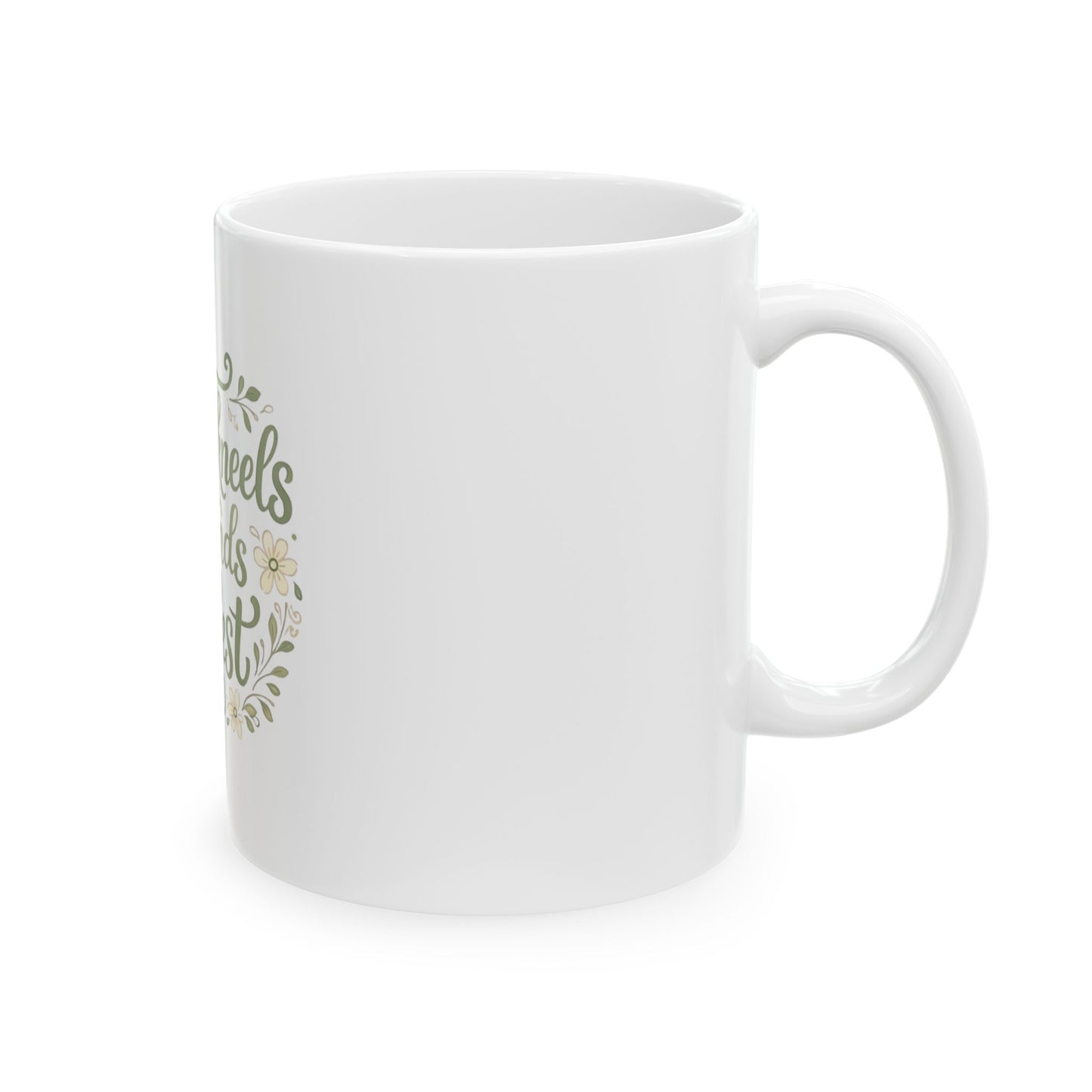 White mug with green text and floral design on a white background